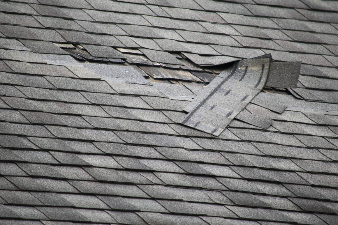 Shingles damaged on house roof