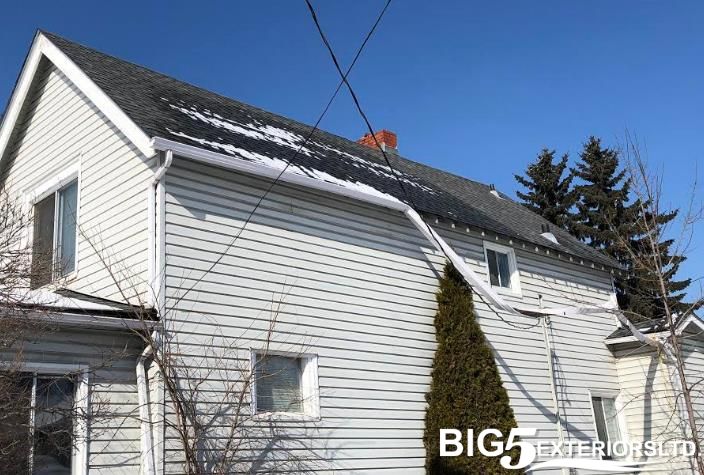 Eavestrough damaged by hail storm