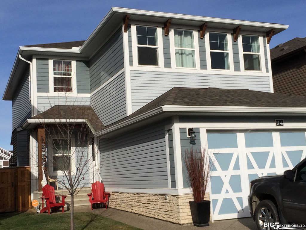 Gorgeous blue home with multiple tones of siding