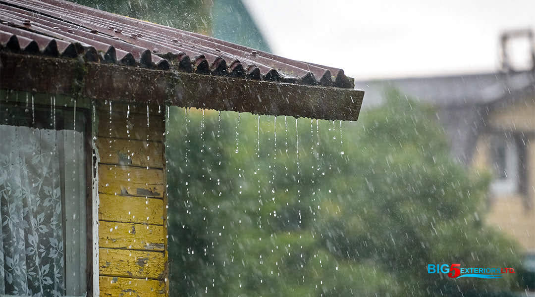 Metal shingle roof on a rainy day