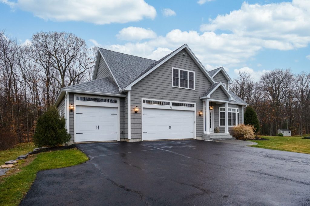 A ranch house with wood siding and white trim.