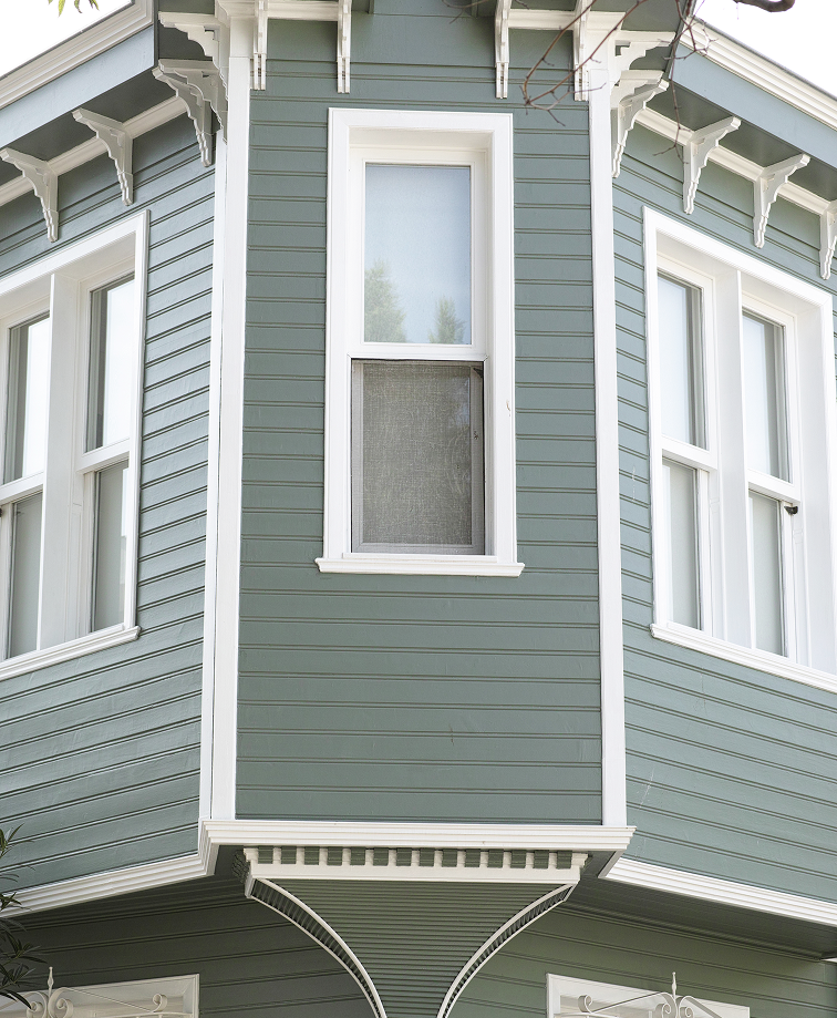 Grey rooftop shingles covering a newly constructed home